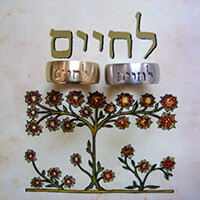 Trauringe 585 Gelb und Weißgold mit eingefrästem Symbol